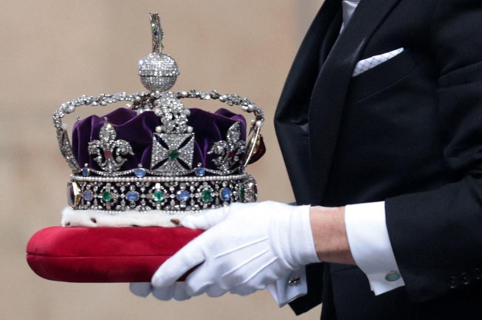 The Imperial State Crown arrives for the State Opening of Parliament at the Houses of Parliament in London on May 11, 2021.