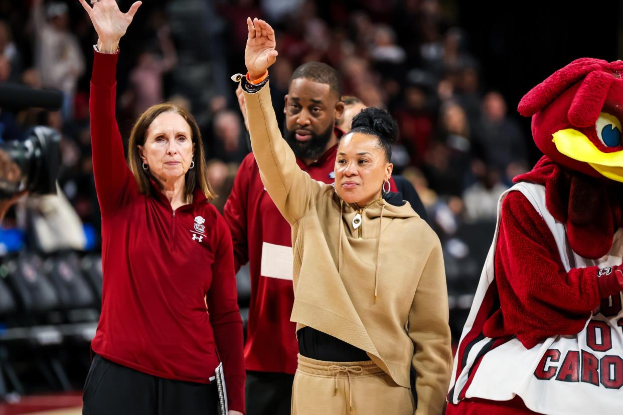 South Carolina Gamecocks coach Dawn Staley waves to the crowd after defeating North Carolina to advance to the Sweet 16.