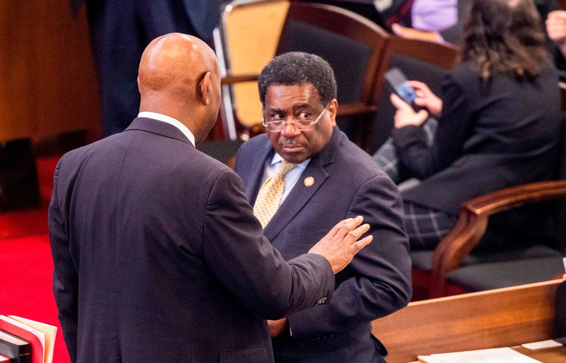 Democratic Reps. Shelly Willingham and Garland Pierce talk on the floor of the North Carolina House before the House convened for its afternoon voting session on Wednesday, May 3, 2022.