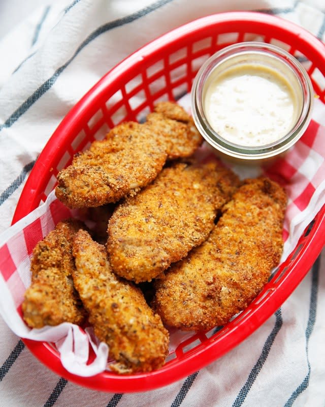 <p>I am seriously so excited about these air fryer chicken tenders! They are gluten-free, low carb, paleo-friendly, and SO delicious and easy to make! You will love making these for a weeknight dinner or for a weekday lunch.</p><p><strong>Get the recipe: <a href="https://lexiscleankitchen.com/air-fryer-chicken-tenders/" rel="nofollow noopener" target="_blank" data-ylk="slk:Air Fryer Chicken Tenders;elm:context_link;itc:0;sec:content-canvas" class="link rapid-noclick-resp">Air Fryer Chicken Tenders</a></strong></p>