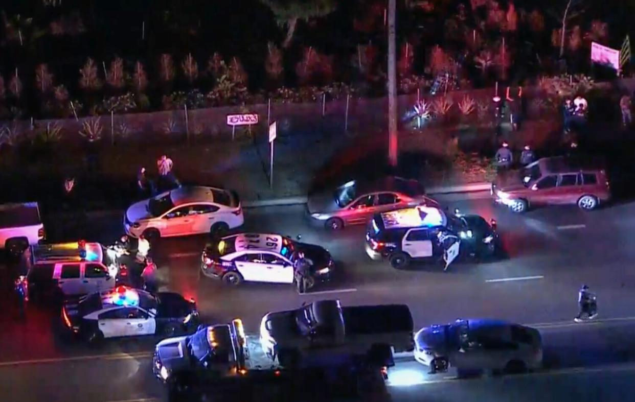 Police cars at a street takeover