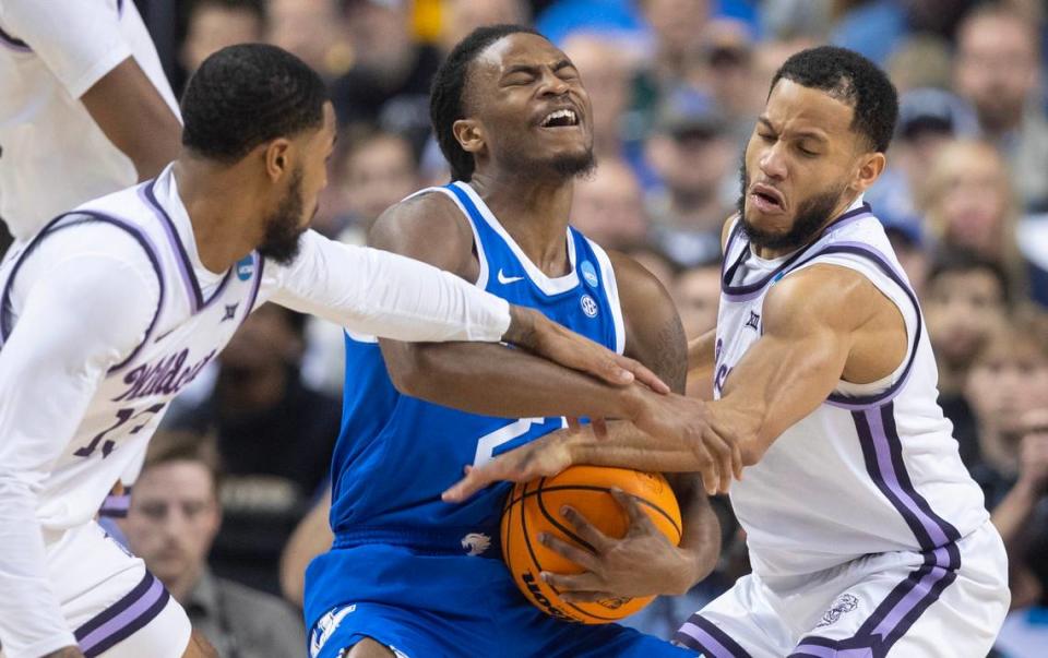 Kansas State’s Markquis Nowell, right, and Desi Sills defend Kentucky’s Cason Wallace during the first half of their second round NCAA Tournament game in Greensboro, NC on Sunday.