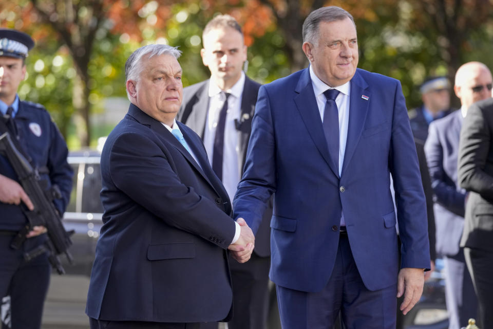 Bosnian Serb leader Milorad Dodik, right, welcomes Hungary's Prime Minister Viktor Orban, in Banja Luka, Bosnia, Friday, April 5, 2024. (AP Photo/Darko Bandic)