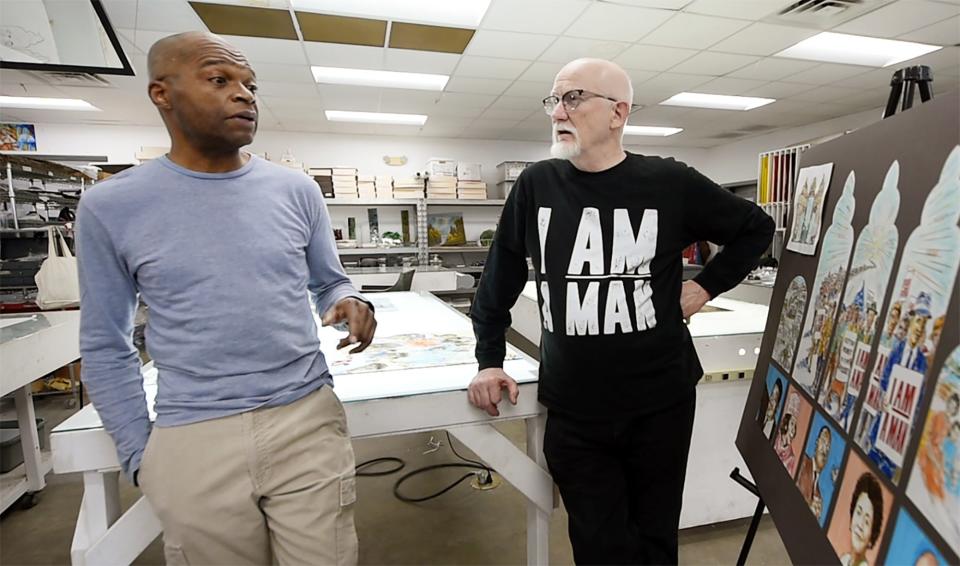 Memphis artist Lonnie Robinson, left, and Pearl River Glass Studio founder Andrew Young, right, discuss the restoration of the windows from historic Clayborn Temple in Memphis, while at the Jackson glass studio on Wednesday.