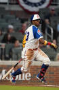 Atlanta Braves' Ronald Acuna Jr. (13) follows through on a triple in the third inning of a baseball game against the Miami Marlins, Monday, April 12, 2021, in Atlanta. (AP Photo/John Bazemore)