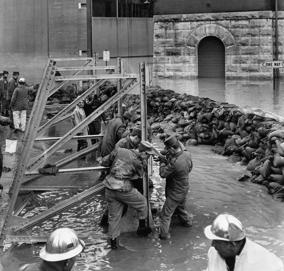 National Guardsmen of the 138th Field Artillery attempted to install a closure at 7th Street and Ft. Nelson Way on March 12, 1964.