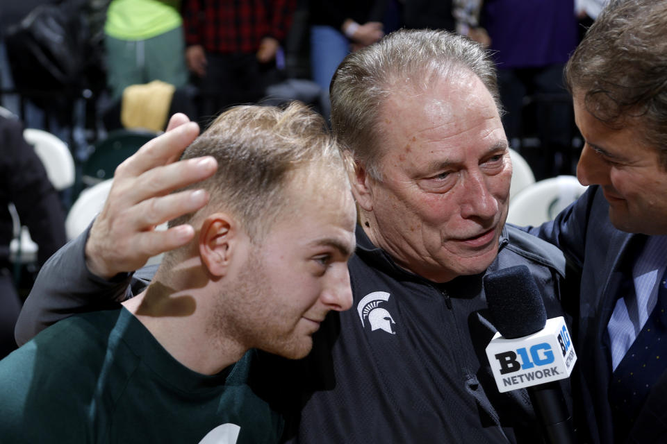 Michigan State coach Tom Izzo, center, and his son, Steven Izzo, left, are interviewed by the Big Ten Network's Andy Katz following an NCAA college basketball game, Wednesday, March 6, 2024, in East Lansing, Mich. (AP Photo/Al Goldis)