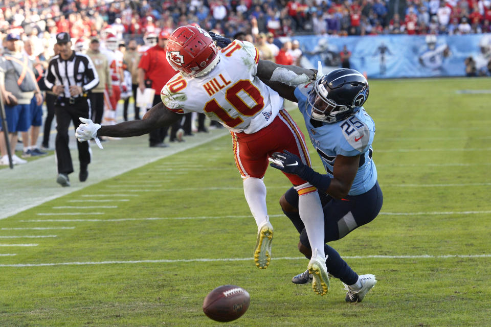 Tennessee Titans cornerback Adoree' Jackson (25) breaks up a pass intended for Kansas City Chiefs wide receiver Tyreek Hill (10) in the second half of an NFL football game Sunday, Nov. 10, 2019, in Nashville, Tenn. (AP Photo/Mark Zaleski)