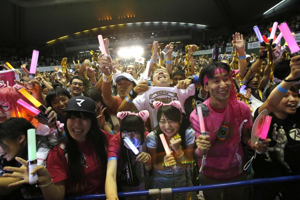 People celebrate after hearing that Tokyo had been chosen to host the 2020 Olympic Games during a public viewing event in Tokyo