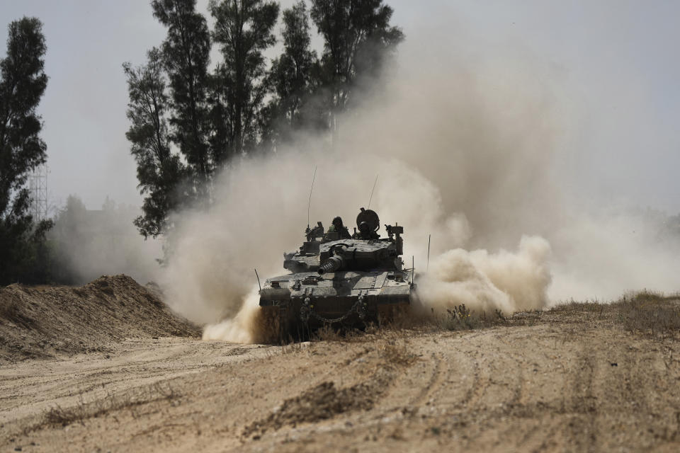 An Israeli tank moves near the Gaza Strip border in southern Israel, Thursday, April 11, 2024. (AP Photo/Tsafrir Abayov)