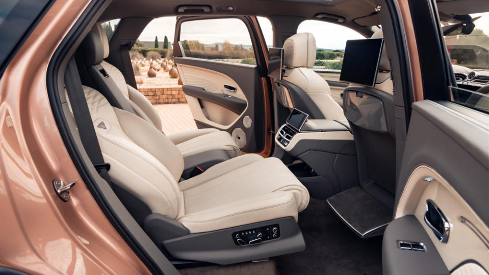 In Relax mode, rear seats recline to 40 degrees, while a leather-trimmed footrest deploys from behind the front passenger seat. - Credit: Bentley Motors Limited