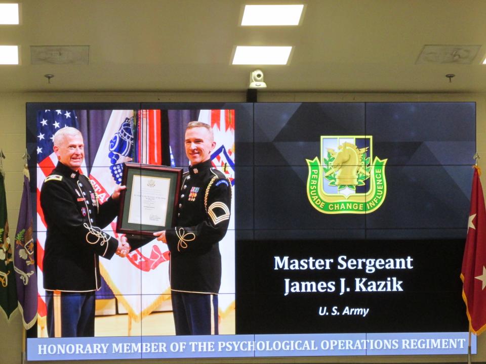 Master Sgt. James Kazik is recognized as an honorary member of the psychological operations regiment during a Nov. 4, 2021, ceremony at Fort Bragg.
