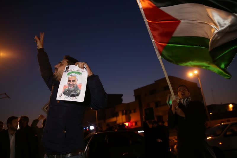 Iranian people celebrate in the street after Iran launched missiles at U.S.-led forces in Iraq, in Tehran