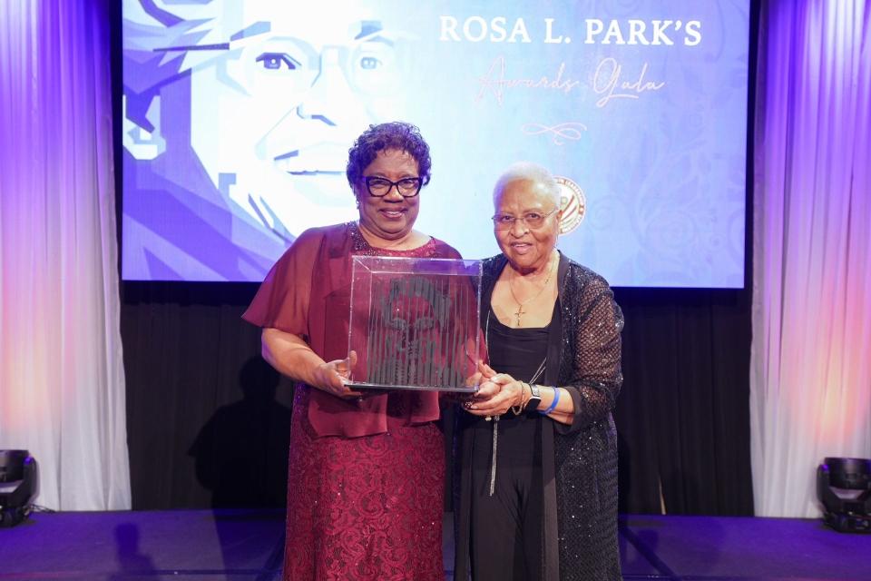 Tuskegee President Charlotte P. Morris accepts award from civil rights activist Doris Crenshaw.