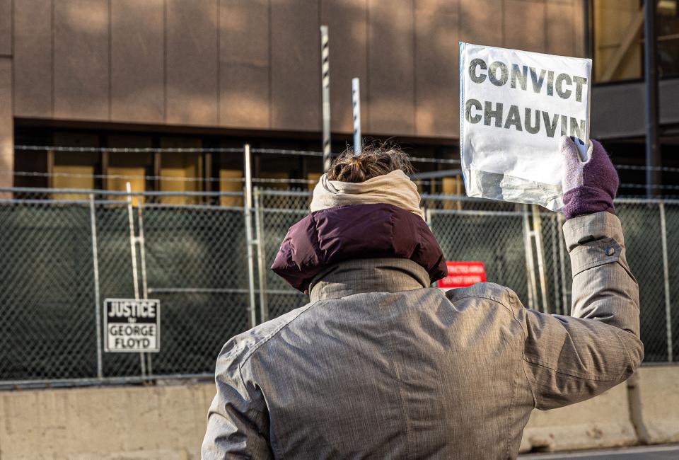 A person protests outside the Hennepin County Government Center in Minneapolis, where the trial of former police officer Derek Chauvin is being held. (Kerem Yucel/AFP via Getty Images)