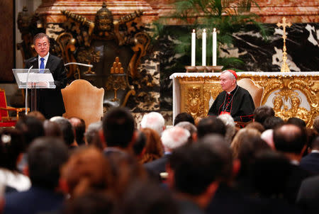 South Korean President Moon Jae-in speaks next to Italian cardinal Pietro Parolin at the end of a special mass for peace in the Korean peninsula in Saint Peter's Basilica at the Vatican, October 17, 2018. REUTERS/Max Rossi