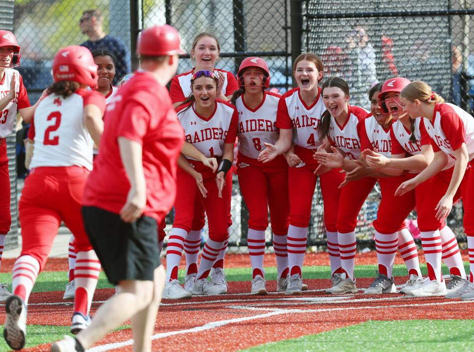 North Rockland players wait to greet teammate after her homer against Tappan Zee during the Rockland County Challenge at Haverstraw Sports Complex April 20, 2024. North Rockland won the game 4-1.