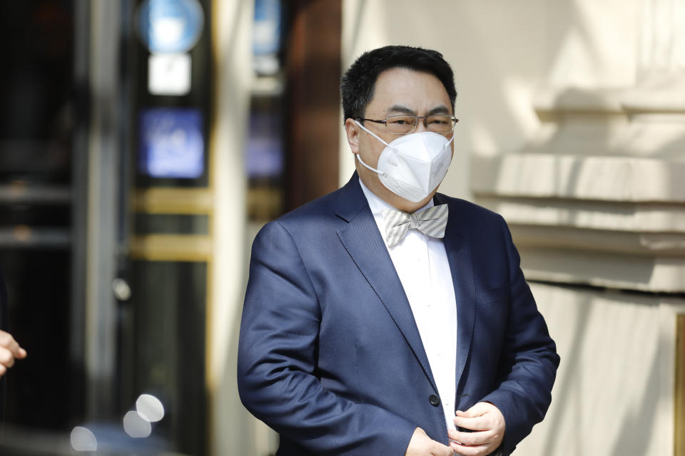 The ambassador of the Permanent Mission of the People's Republic of China to the United Nations, Wang Qun, leaves the 'Grand Hotel Vienna' where closed-door nuclear talks with Iran take place in Vienna, Austria, Tuesday, April 20, 2021. (AP Photo/Lisa Leutner)