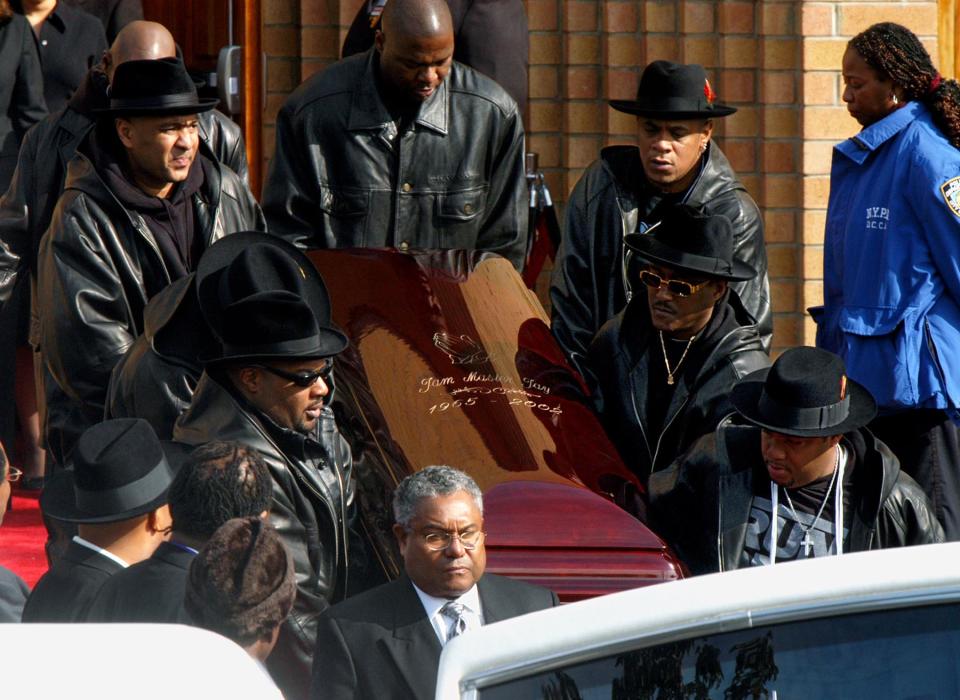 NEW YORK, UNITED STATES:  The coffin of Run DMC's Jam Master Jay, nee Kevin Mizell, is carried out of Allen A.M.E Cathedral after his funeral 05 November, 2002. Mizell was shot to detach 30 October, 2002 in a New York Recording studio.    AFP PHOTO/Henny Ray ABRAMS (Photo credit should read HENNY RAY ABRAMS/AFP via Getty Images)