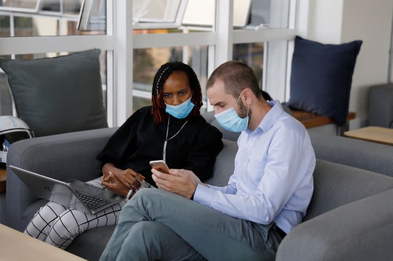 Jason Carmichael, Chief Executive Officer and Co-Founder and Dr. Muthoni Karanja Lead Medical Consultant from the Nairobi-based TIBU startup, speak in their office in Nairobi