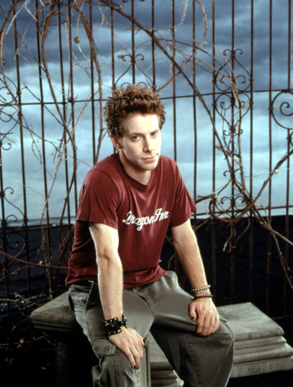 Seth Green posing as Oz in a graveyard