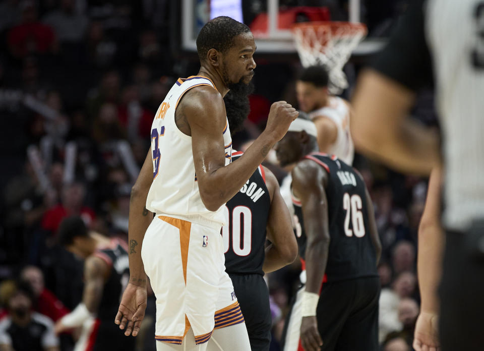 Phoenix Suns forward Kevin Durant pumps his fist during the second half of an NBA basketball game against the Portland Trail Blazers in Portland, Ore., Sunday, Jan. 14, 2024. (AP Photo/Craig Mitchelldyer)