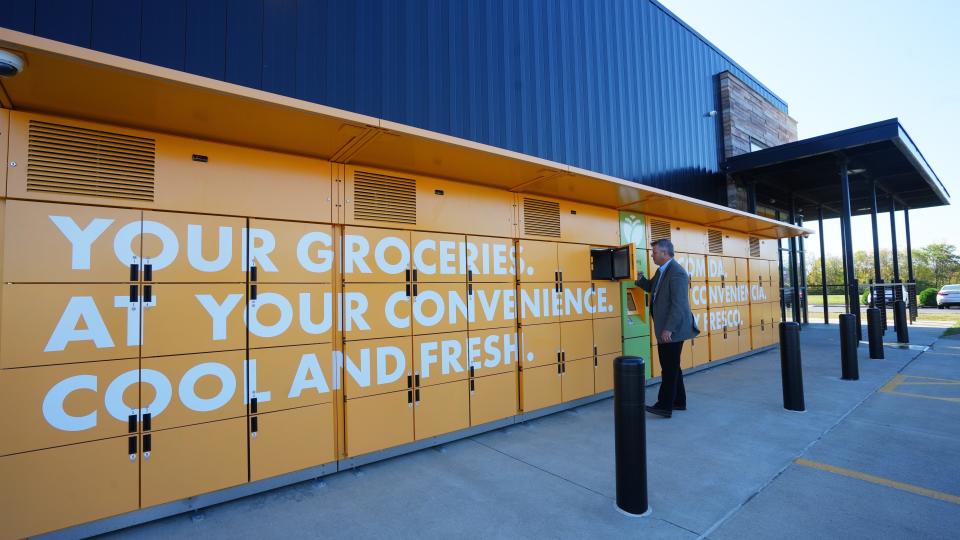 Brad Draper, Senior Vice President of Operations for the Mid-Ohio Food Collective, on Tuesday demonstrates the new 24-hour food lockers available at the 620 Norton Road food center. Draper said the lockers will be especially helpful to people who work nights and weekends.