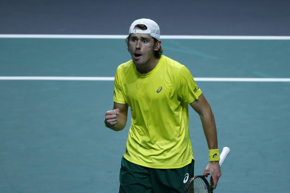 Australia's Alex de Minaur celebrates after defeating Netherland's Botic van de Zandschulp during a Davis Cup quarter-final tennis match between Australia and The Netherlands in Malaga, Spain, Tuesday, Nov. 22, 2022. (AP Photo/Joan Monfort)