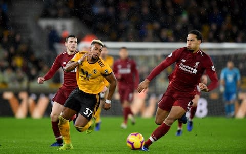 Adama Traore of Wolverhampton Wanderers and Virgil van Dijk of Liverpool during the Premier League match between Wolverhampton Wanderers and Liverpool FC - Credit: Getty Images