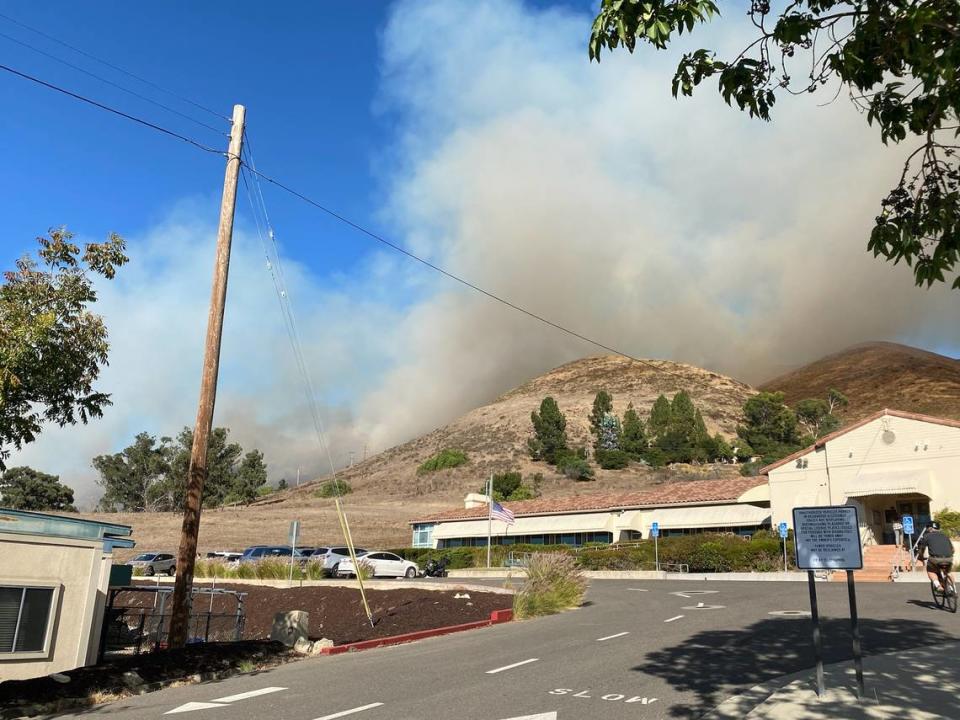 A vegetation fire burns in the hills near Lizzie Street in San Luis Obispo on Monday Oct. 30, 2023. Nearby residents were ordered to evacuate.