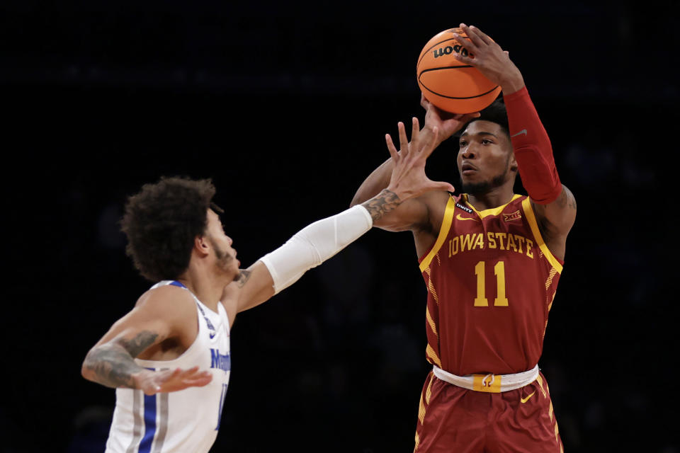 Iowa State's Tyrese Hunter (11) shoots over Memphis' Lester Quinones during the first half of an NCAA college basketball game in the NIT Season Tip-Off tournament Friday, Nov. 26, 2021, in New York. (AP Photo/Adam Hunger)