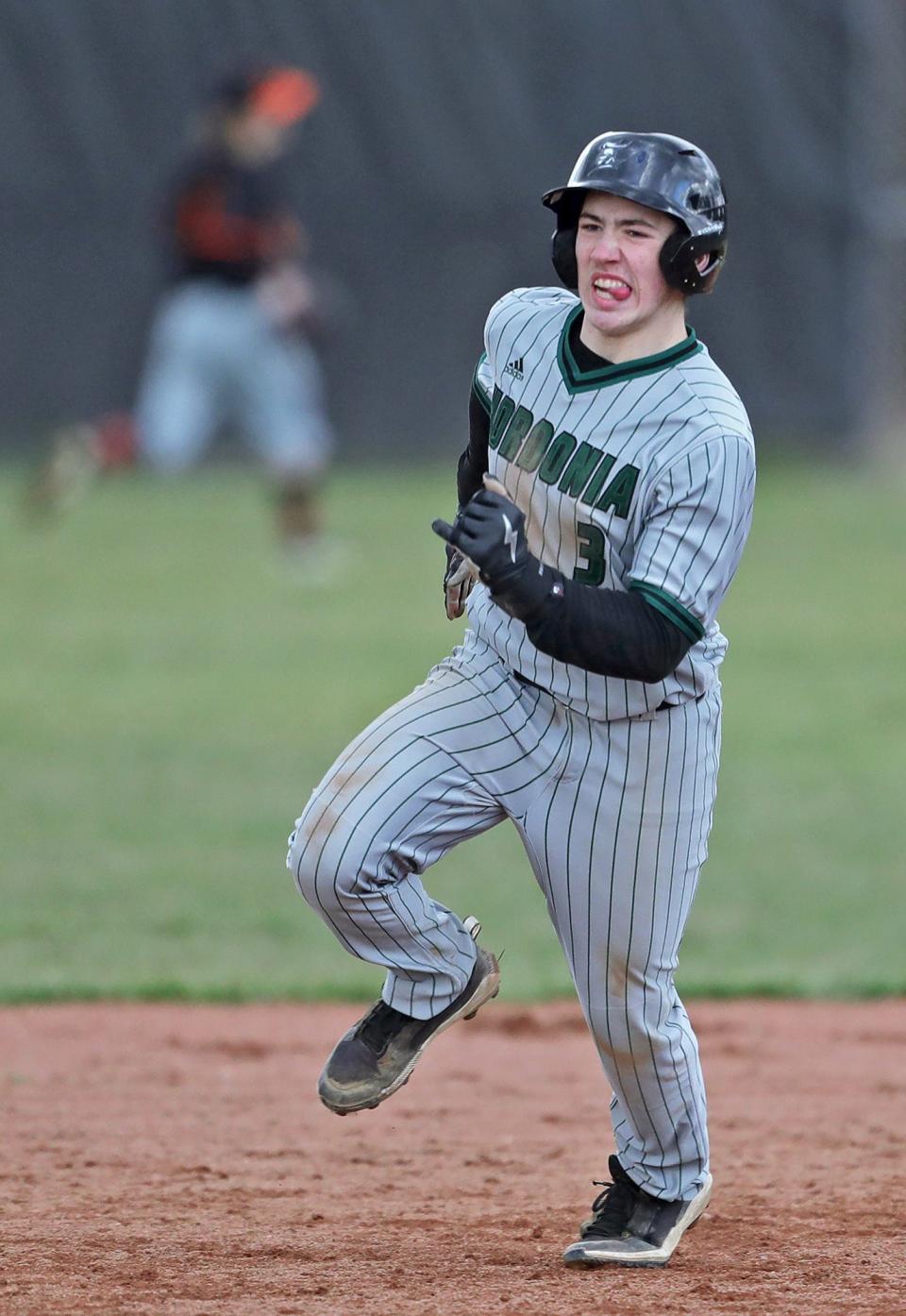 Nordonia baserunner Dash Lanzilotta sprints to third base on a shot by Hunter Grams during the third inning of a baseball game against the Green Bulldogs on Friday.