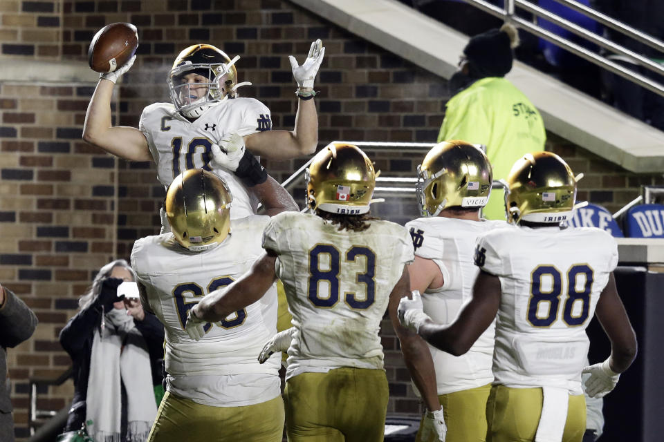 Notre Dame wide receiver Chris Finke (10) is congratulated by teammates following Finke's touchdown against Duke during the second half of an NCAA college football game in Durham, N.C., Saturday, Nov. 9, 2019. (AP Photo/Gerry Broome)