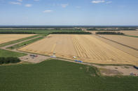 Harvesters collect wheat on a field in Krasnodar region, southern Russia, Friday, July 1, 2022. Russia is the world's biggest exporter of wheat, accounting for almost a fifth of global shipments. It is expected to have one of its best ever crop seasons this year. Agriculture is among the most important industries in Russia, accounting for around 4% of its GDP, according to the World Bank. (AP Photo)