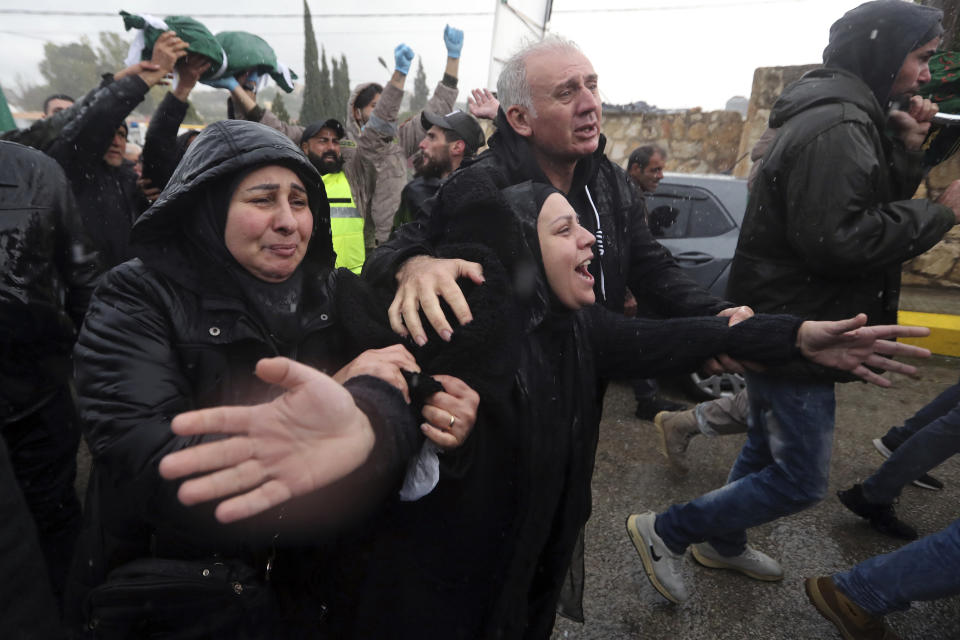 Amal Atwi, the mother of Hussein Jalal Mohsin, who was killed in an Israeli strike last night, mourns during his funeral procession in Qantara village, south Lebanon, Thursday, Feb. 15, 2024. The civilian death toll from two Israeli airstrikes in Lebanon has risen to 10, Lebanese state media reported Thursday, making the previous day the deadliest in more than four months of cross-border exchanges. (AP Photo/Mohammed Zaatari)