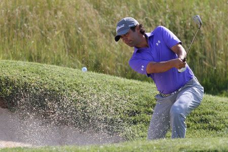 Jun 29, 2017; Potomac, MD, USA; Martin Flores plays from a bunker on the 14th hole during the first round of the Quicken Loans National golf tournament at TPC Potomac at Avenel Farm. Mandatory Credit: Geoff Burke-USA TODAY Sports