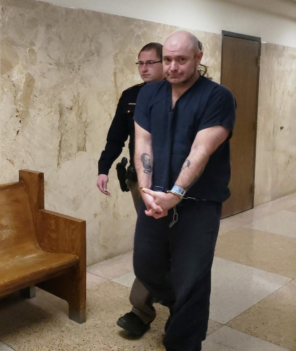 Kethan Anderson is escorted Wednesday out of a Lubbock County courtroom after he pleaded guilty to murder. His punishment will be determined by district judge William Eichman at a later date.