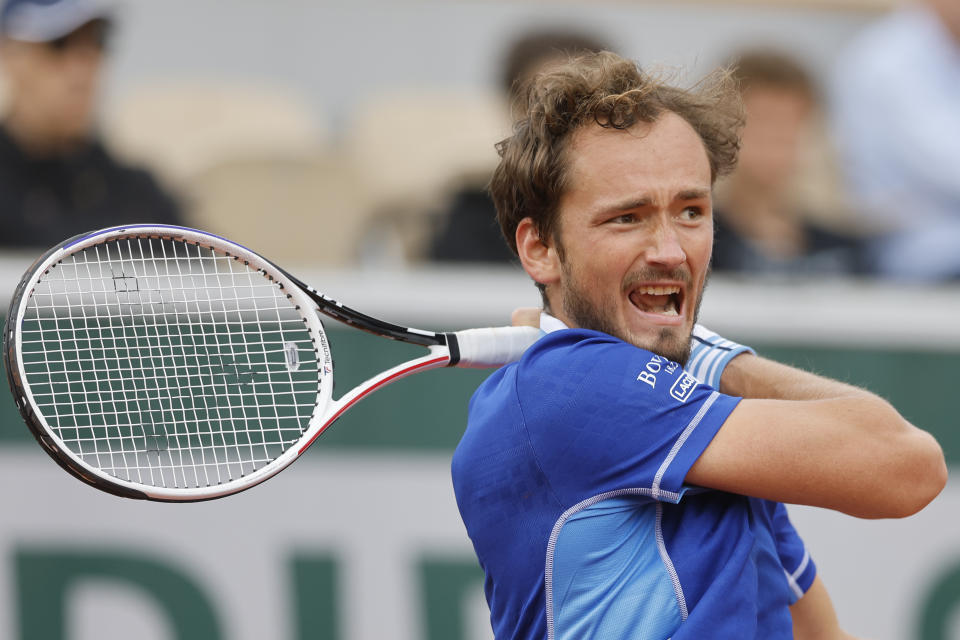 Russia's Daniil Medvedev plays a shot against Argentina's Facundo Bagnis during their first round match at the French Open tennis tournament in Roland Garros stadium in Paris, France, Tuesday, May 24, 2022. (AP Photo/Jean-Francois Badias)