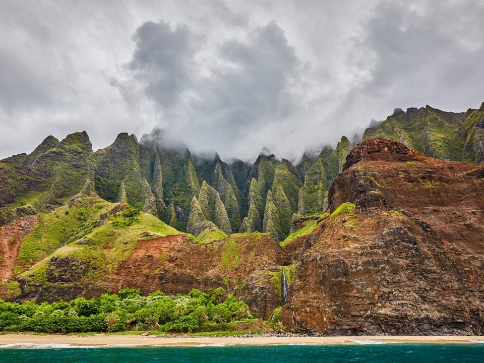 Fog gathers over the mountains at Nāpali Coast State Wilderness Park.