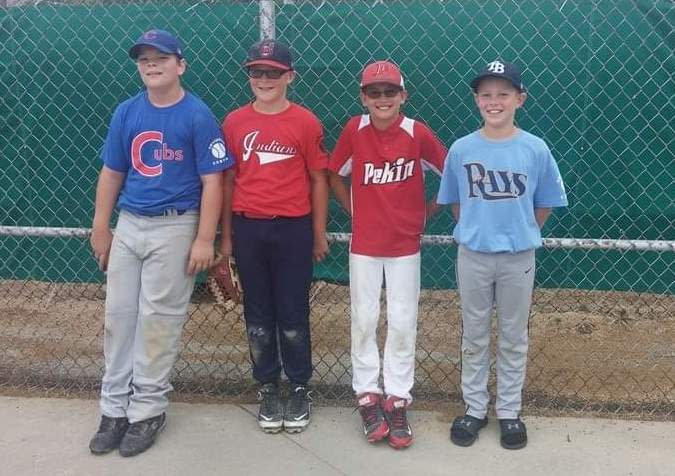 The Brimfield-Elmwood team's baseball journey started at a young age together for these four lifelong friends, left-to-right, Frank Kelch, Drew Bryant, Aaron Miller and Levi Moon. Miller would have been on the field with his fellow seniors Monday in the IHSA Supersectional had he not died in a tragic car accident in 2020. The other three boys pictured were in uniform Monday and had Miller's No. 4 on their ballcaps to remember him.