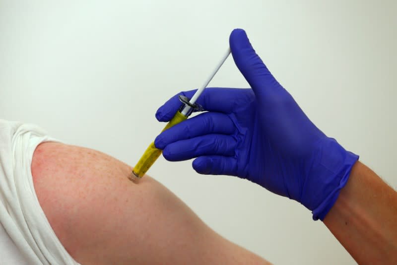 FILE PHOTO: A volunteer receives a trial Ebola vaccine at the Centre for Clinical Vaccinology and Tropical Medicine in Oxford