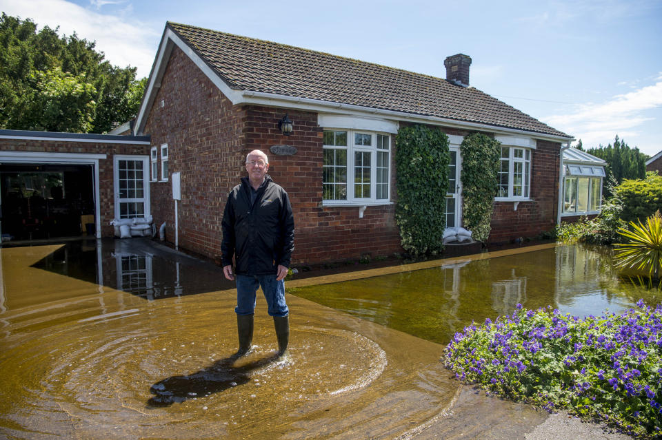 John Rowlings outside his flooded home on Croft Lane in Wainfleet