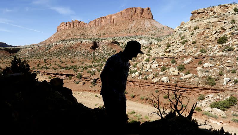 Nick Proctor walks in the Colt Mesa area of the former Grand Staircase-Escalante National Monument on Friday, May 14, 2021. The land pictured across from the dirt road is part of the national monument.