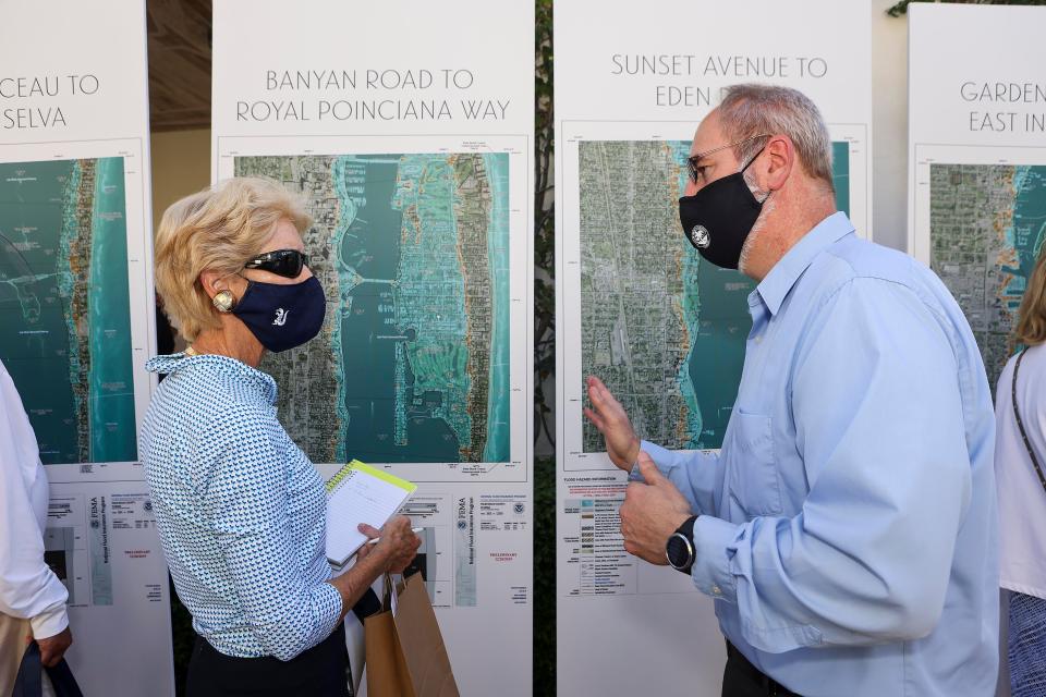 Palm Beach civil engineer Craig Hauschild helps West Palm Beach resident Ann Tyler understand what she can do to keep her garage from flooding during a flood-risk workshop in April at the Preservation Foundation of Palm Beach.
