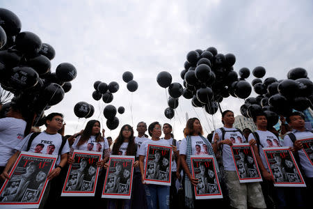 FILE PHOTO: Activists gather at a rally, calling for the release of imprisoned Reuters journalists Wa Lone and Kyaw Soe Oo, one year after they were arrested, in Yangon, Myanmar December 12, 2018. REUTERS/Myat Thu Kyaw/File Photo