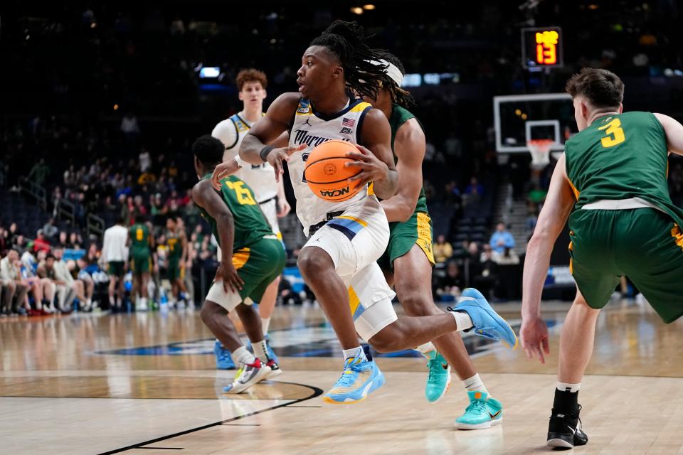 Mar 17, 2023; Columbus, Ohio, USA;  Marquette Golden Eagles guard Sean Jones (22) drives to the basket during the first round of the NCAA men’s basketball tournament against the Vermont Catamounts at Nationwide Arena. Marquette won 78-61. Mandatory Credit: Adam Cairns-The Columbus Dispatch