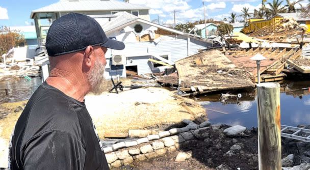 PHOTO: John Lynch looks at his uncle's house that was destroyed during Hurricane Ian, in Matlacha, Fla. (Miles Cohen/ABC News)