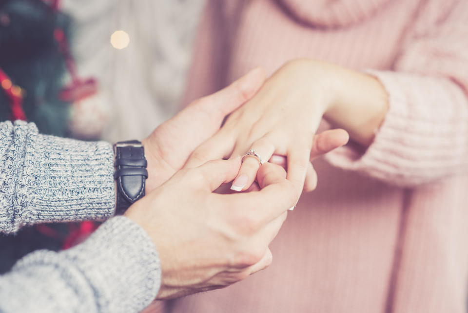 Stock picture of couple getting engaged. (Getty Images)