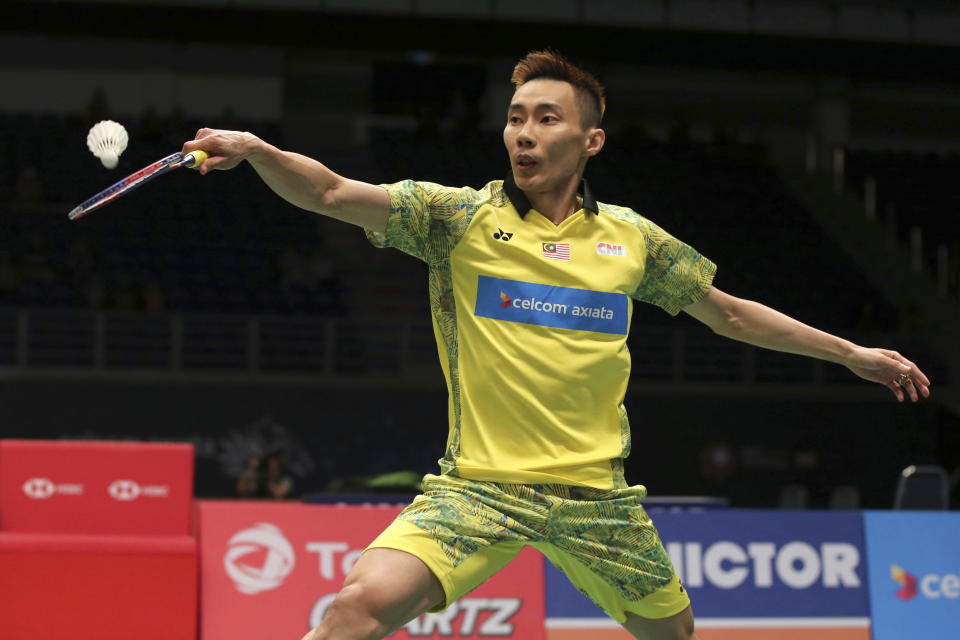 Malaysian Lee Chong Wei returns a shot to Denmark's Viktor Axelsen at the Malaysia Badminton Open 2018 in Kuala Lumpur, Malaysia, Friday, June 29, 2018. (AP Photo/Vincent Phoon)