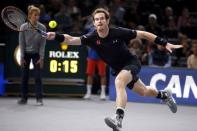 Andy Murray of Britain stretches to return the ball to David Ferrer of Spain in their men's singles semi-final tennis match at the Paris Masters tennis tournament at the Bercy sports hall in Paris, France, November 7, 2015. REUTERS/Charles Platiau